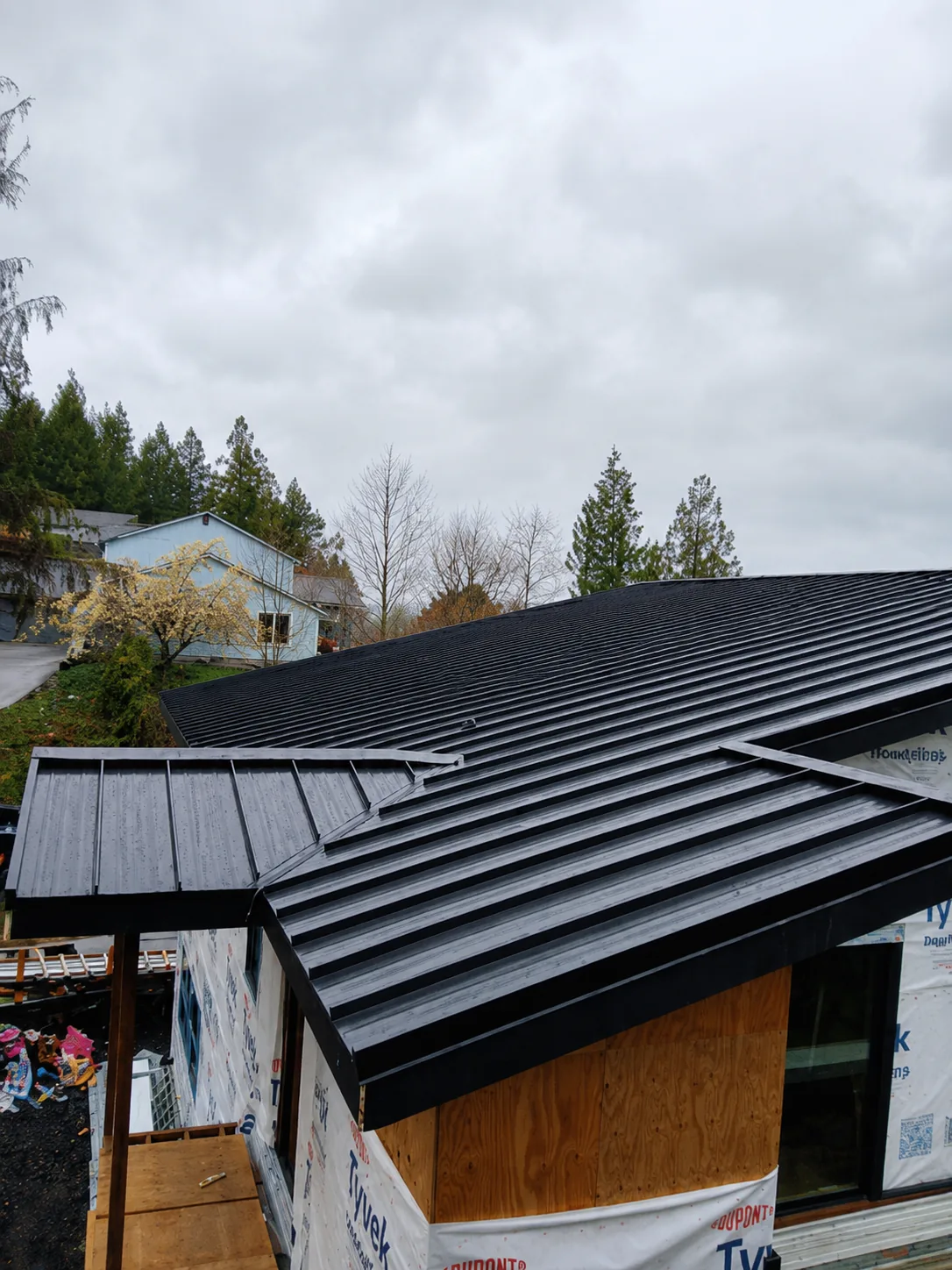 Black standing-seam metal roof installation, Spokane WA