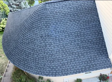 Curved roof section with shingles fanned around the curve, installed by DG Contracting