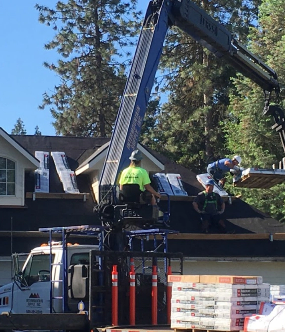 DG Contracting inspecting storm damage on a Spokane roof