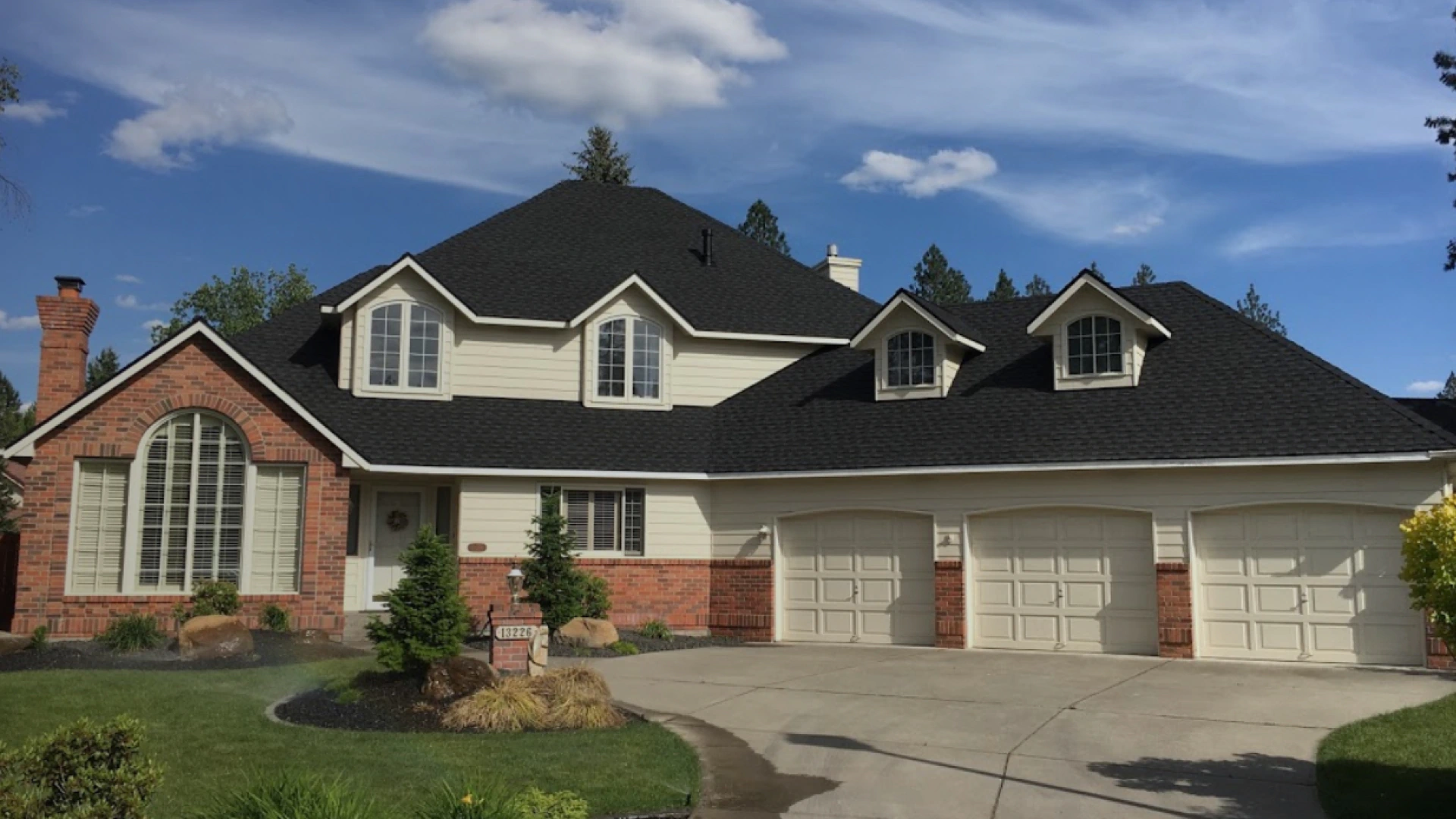 luxurious house with black asphalt roof shingle installed spokane wa